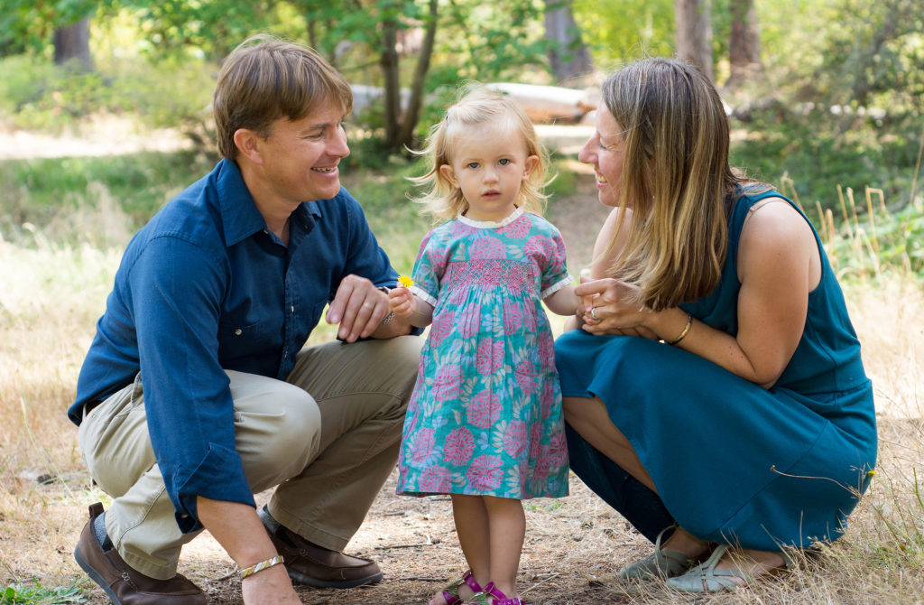 little girl with her famly